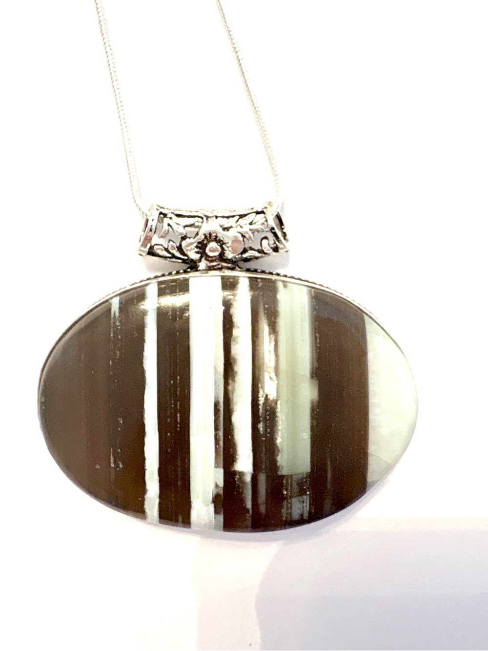 Beautiful, 2 inch wide, handcrafted Owhyee Blue Opal pendant on a silver chain..